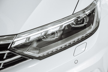 Front headlight of a car. Headlamp © Fostic