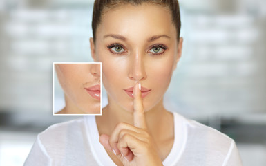 young woman with finger on her lips