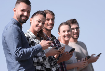 group of young people with modern smartphones.