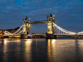 Fototapeta na wymiar Tower Bridge at night illuminated by floodlights.