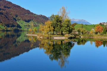 swiss lake at the village lungern, in autumn 