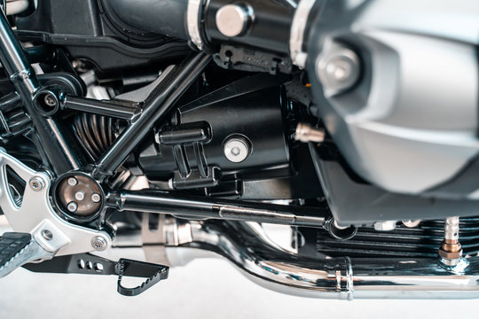 Cropped image of new motorcycle in shop.