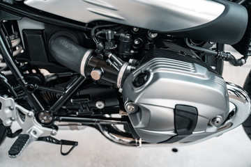 Cropped image of new motorcycle in shop.