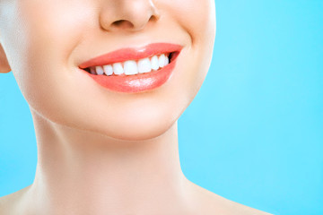 Perfect healthy teeth smile of a young woman. Teeth whitening. Dental clinic patient. Stomatology, dentistry concept.