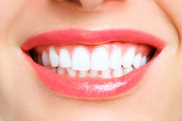 Perfect healthy teeth smile of a young woman. Teeth whitening. Dental clinic patient. Stomatology concept.