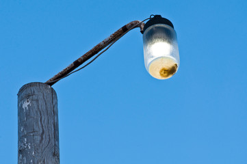 Fototapeta premium Street lantern on the Azov beach on camping territory