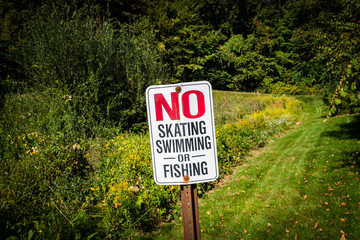 no skating, no swimming or no fishing sign
