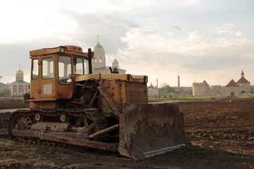 Construction and restoration work with the help of an archaic bulldozer of the USSR. Ottoman stronghold (citadel) on the banks of the Dniester. Bender fortress.