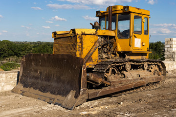 Construction and restoration work with the help of an archaic bulldozer of the USSR. Ottoman stronghold (citadel) on the banks of the Dniester. Bender fortress. © Piotr
