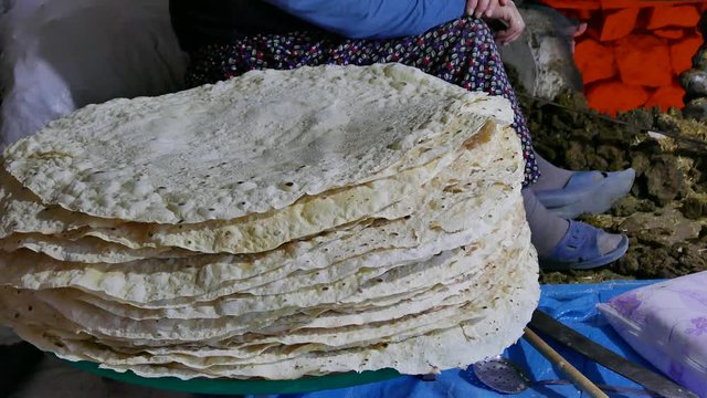 village women making yufka bread in tandoor, yufka bread in central Anatolia,
