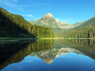 Alpine lake Obersee in the Glarus Alps mountain massif and in the Glarnerland tourist region,...