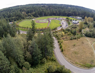 Fantastic aerial views of the Sehmel Homestead Park with the surrounding forest and bright clouds