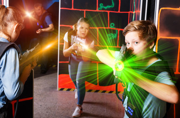 Teen boy playing laser tag