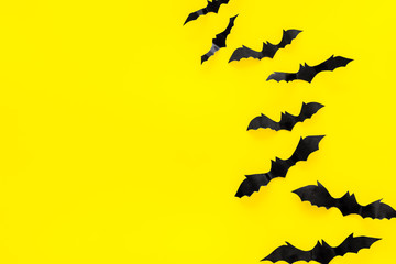 Halloween design. Bats on yellow background top view space for text