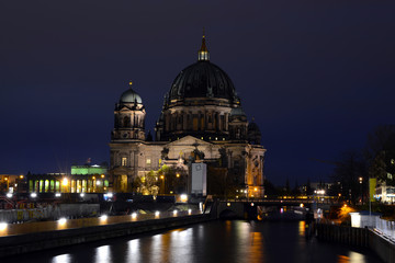 Cathedral of Berlin with Spree river at night