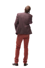 Fototapeta premium rear view. young man with smartphone looking at blank screen