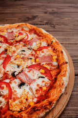 Pepperoni Pizza with Mozzarella cheese, Ham, Tomatoes, pepper, Spices . Italian pizza.