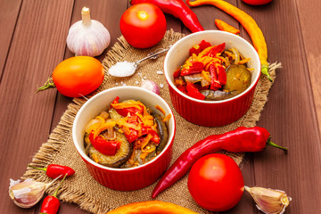 Marinated salad with pickled vegetables: eggplant, carrot, pepper, tomato, garlic