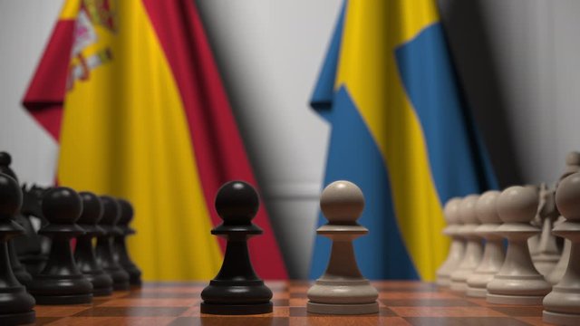 Flags of Spain and Sweden behind pawns on the chessboard. Chess game or political rivalry related 3D animation