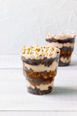 Delicious dessert in a glass, with chocolate ganache, caramel and creme brulee.
