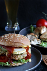 Brain Burger. Fried brains beef, calf or sheep are fried in deep fried as a cutlet in a burger. shows a sandwich in a section. fashionable exotic food. Zombie food. weird food. hipster food