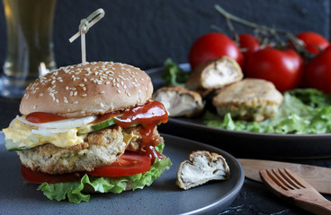 Brain Burger. Fried brains beef, calf or sheep are fried in deep fried as a cutlet in a burger. shows a sandwich in a section. fashionable exotic food. Zombie food. weird food. hipster food