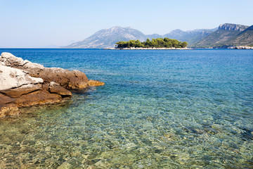 Fototapeta na wymiar Pebble beach on Peljesac peninsula near Zuljana, Adriatic Sea, Croatia