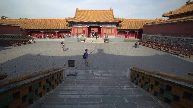 High angle view of man photographing while standing on footpath in Forbidden City - Beijing, China