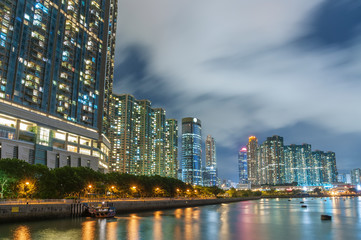 Seaside residential building in Hong Kong city at night