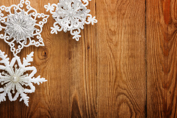 Snowflakes on wood background