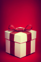 Gift box on red background