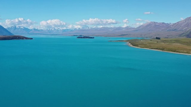 Panoramic view of lake Tekapo in sunny day, New Zealand