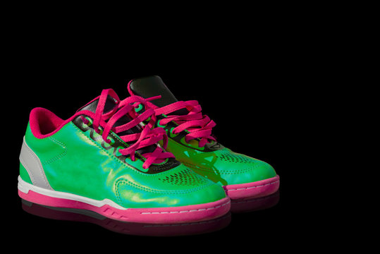 Fashion shoes isolated from shiny black, reflective background clipping partible
