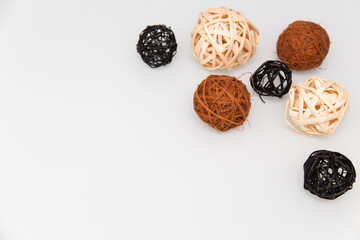  Decorative wicker balls lie on the table.Horizontally.