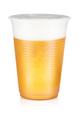 Beer, ale or lager in a plastic disposable cup isolated on white background