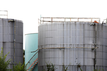 multi colored round oil and petrochemical  storage tanks