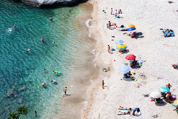 aerial view of people sunbathing on the beach