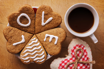 Hearts and coffee on a wooden background