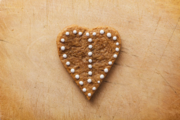 Heart of the cookie and wooden background