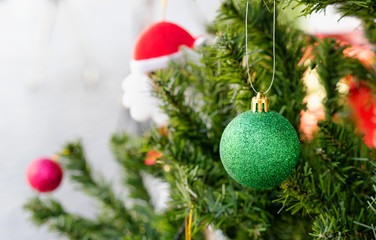 Merry Christmas , Green ball in front of christmas tree