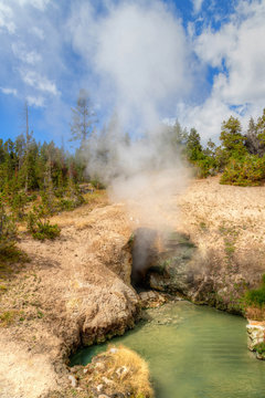 Steam Emits From Dragon's Mouth Spring Cave at Yellowstone National Park