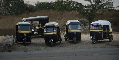 Obraz na płótnie Canvas Black and yellow, india Taxi (TukTuk)