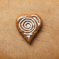 Heart of the cookie and wooden background