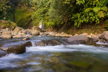 Naklejka na ściany i meble waterfall and forest in green mountain. Bengkulu, indonesia