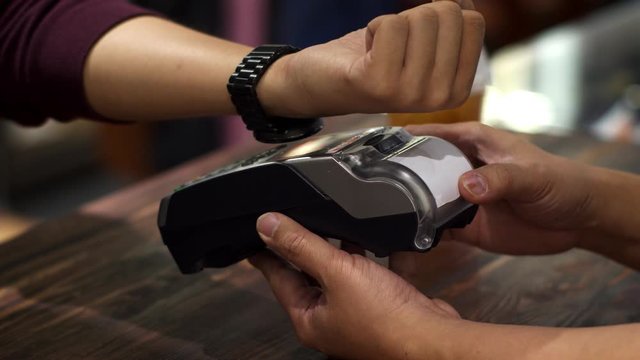 Customer using smart watch to payment with credit transaction
