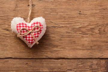 Valentines day background with handmaded hearts over wood