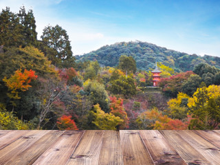 Naklejka na ściany i meble Wood table top over Japan autumn blur background.