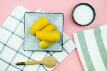 Banana in syrup with coconut milk cream