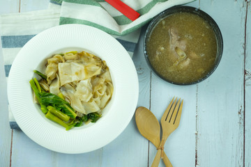 Rice noodle with pork and kale vegetable