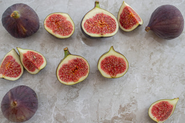 Fresh figs. Whole figs and sliced in half figs in ceramic bowl.